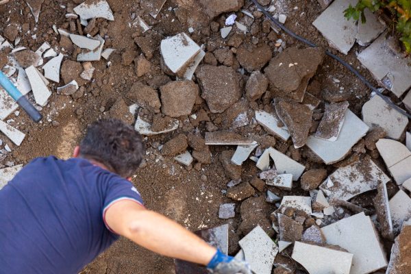 Broken tiles to be removed for a new paving in the garden.